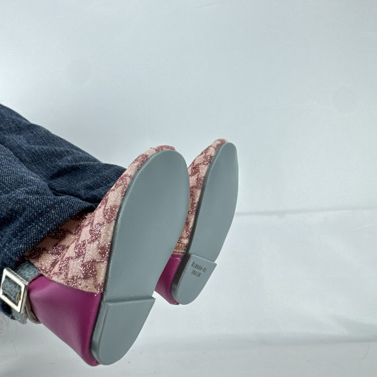 Our Generation 18-inch African American doll in pink wrap top and denim pants with long dark brown hair