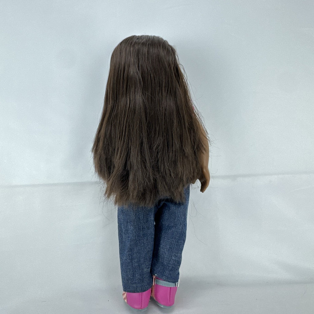 Our Generation 18-inch African American doll in pink wrap top and denim pants with long dark brown hair