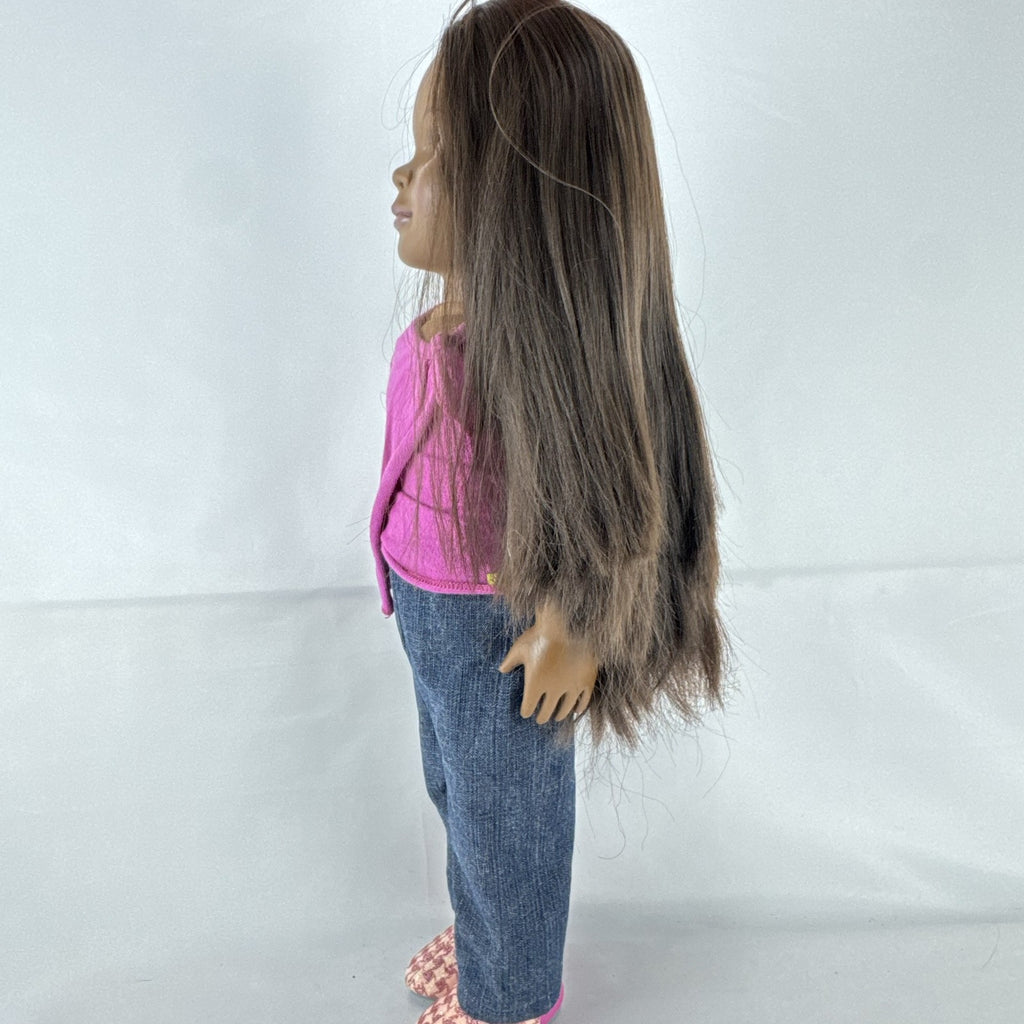 Our Generation 18-inch African American doll in pink wrap top and denim pants with long dark brown hair