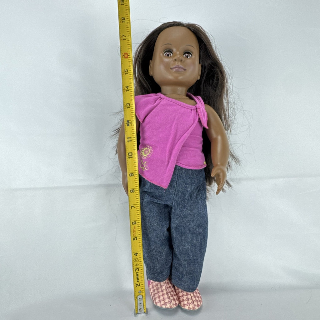Our Generation 18-inch African American doll in pink wrap top and denim pants with long dark brown hair