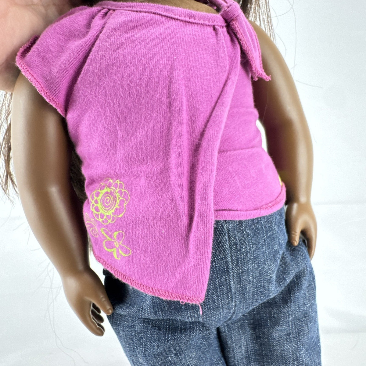 Our Generation 18-inch African American doll in pink wrap top and denim pants with long dark brown hair