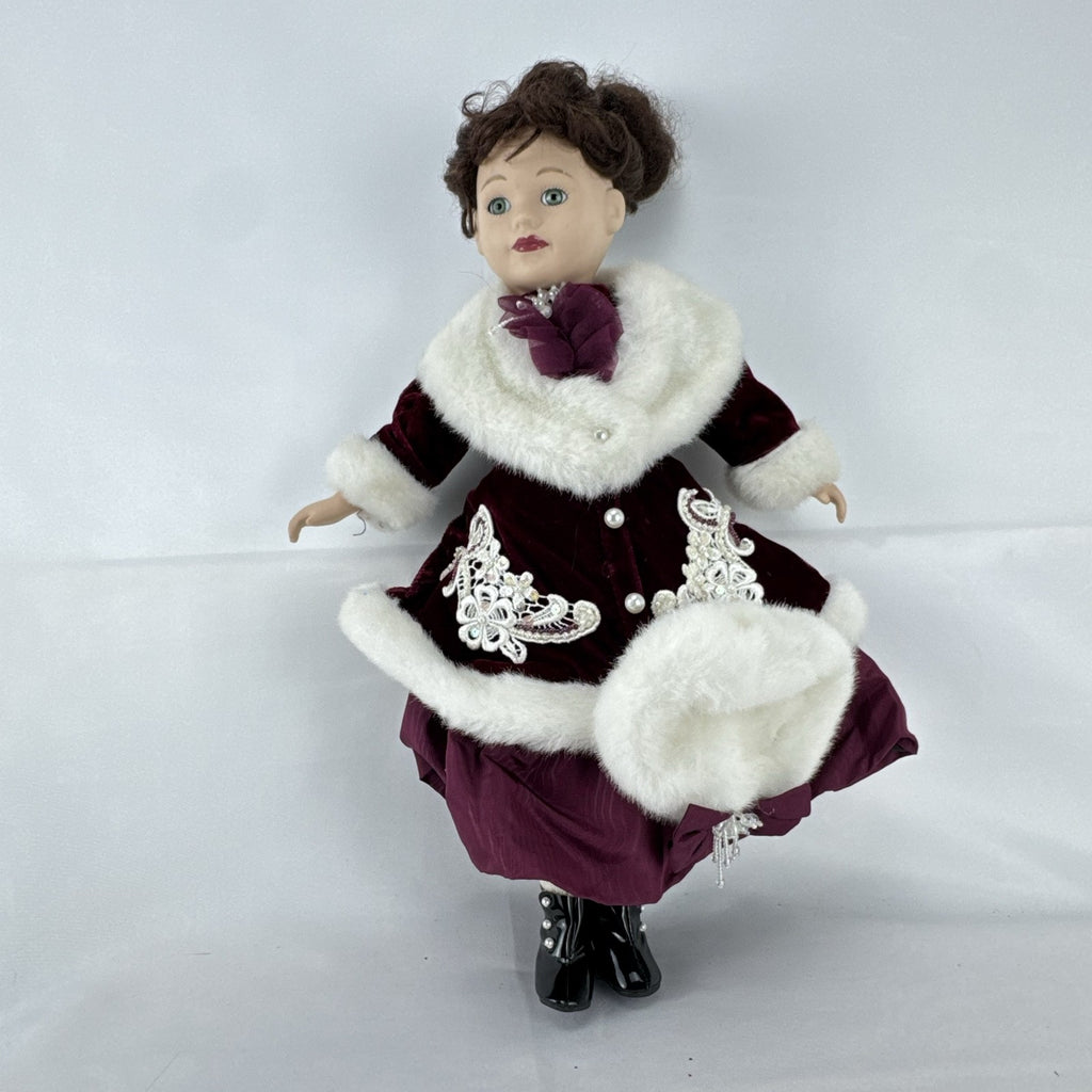The Brass Key 15-inch Victorian porcelain doll in burgundy velvet winter coat with white faux fur trim and muff