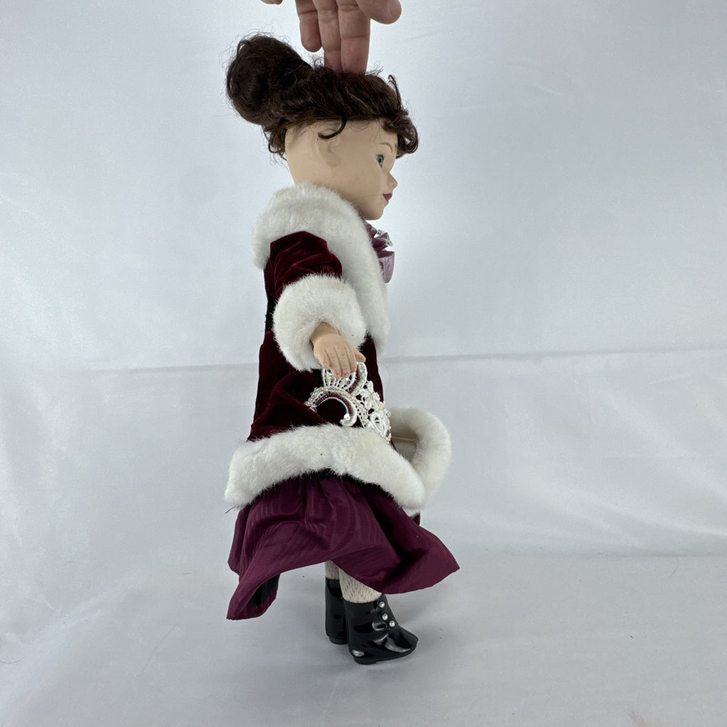 The Brass Key 15-inch Victorian porcelain doll in burgundy velvet winter coat with white faux fur trim and muff