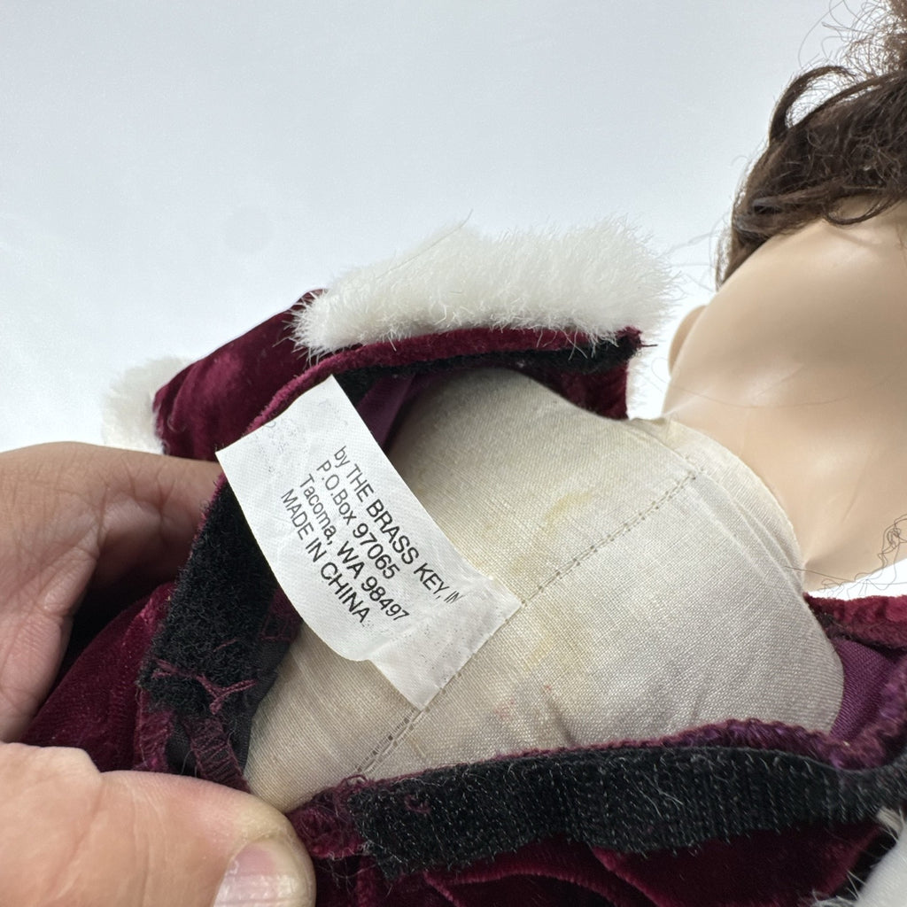 The Brass Key 15-inch Victorian porcelain doll in burgundy velvet winter coat with white faux fur trim and muff