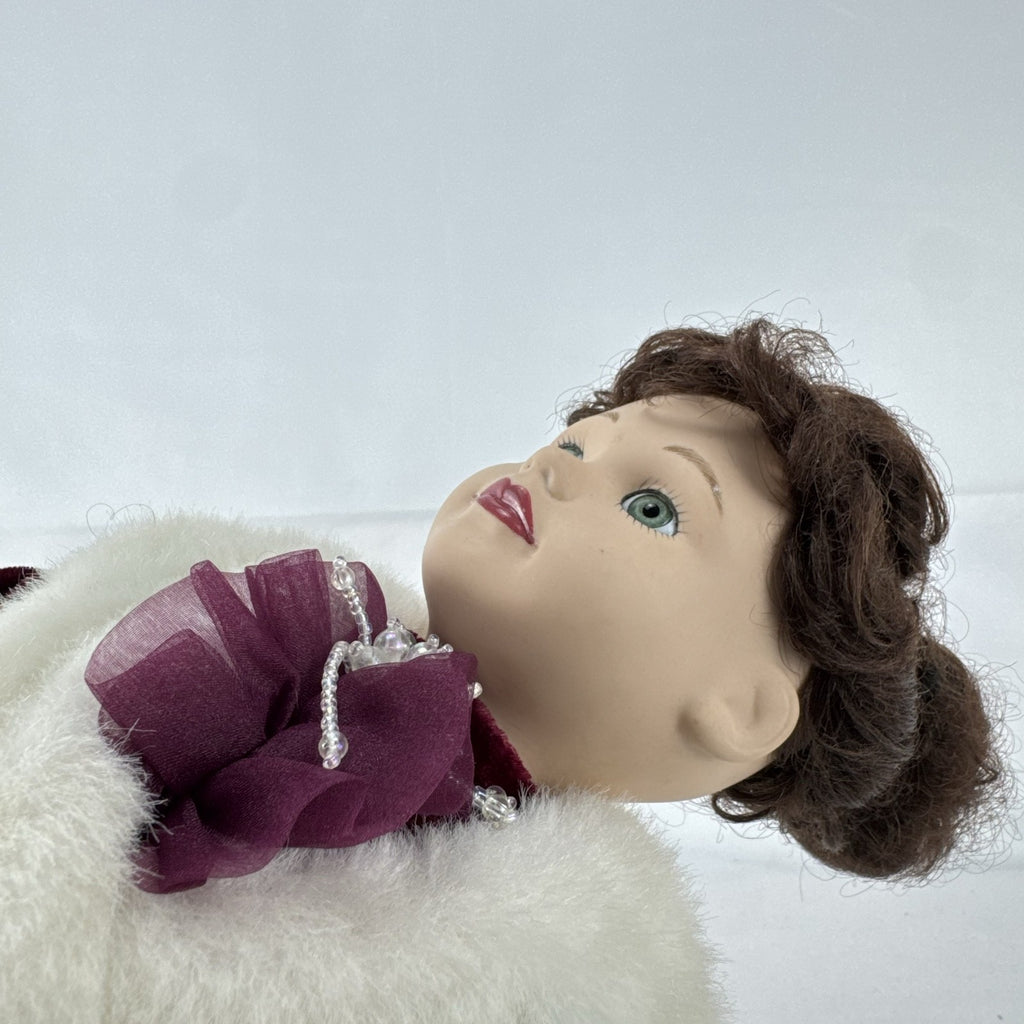 The Brass Key 15-inch Victorian porcelain doll in burgundy velvet winter coat with white faux fur trim and muff