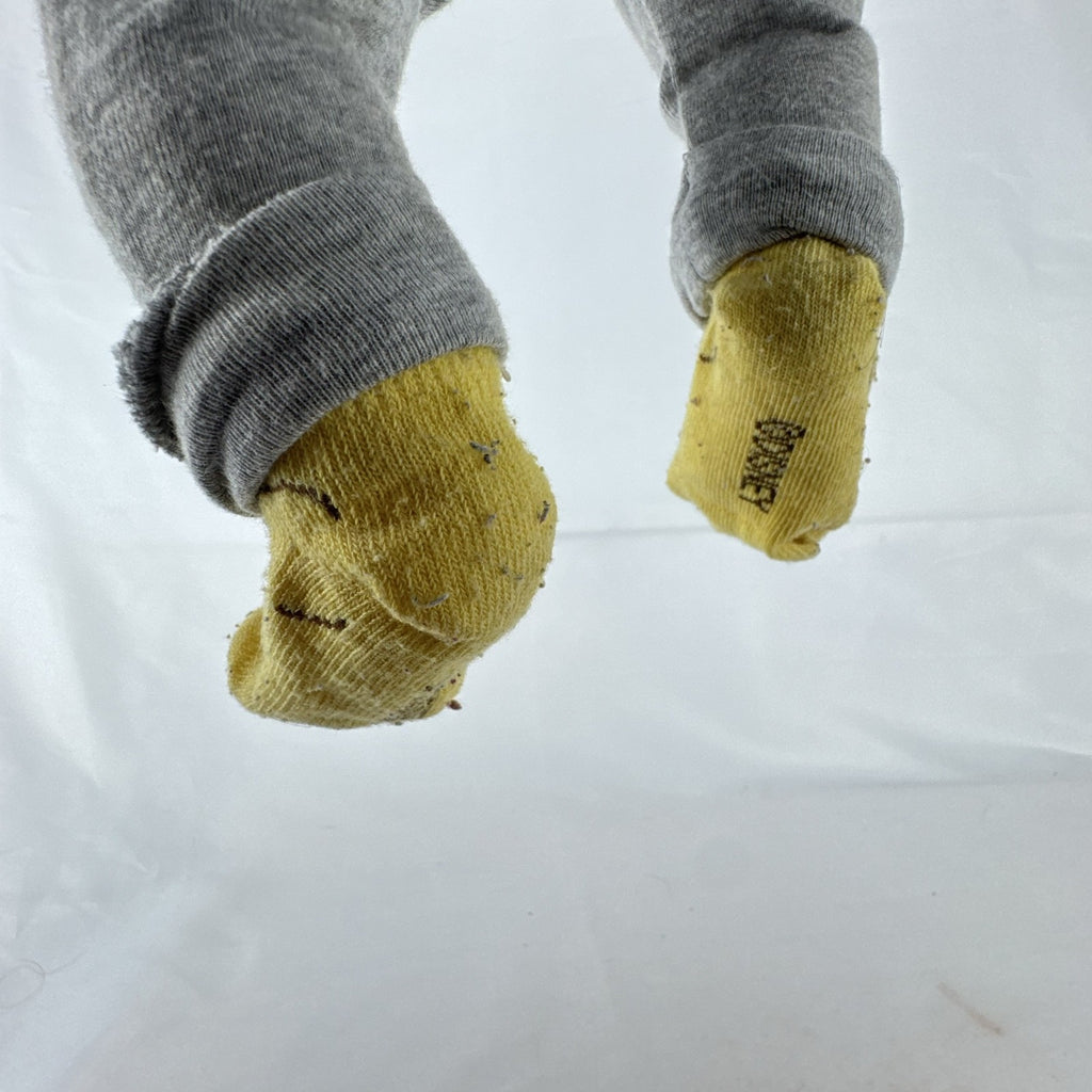 The Ashton-Drake Galleries 16-inch vinyl reborn baby doll sculpted by Ping Lau in grey loungewear