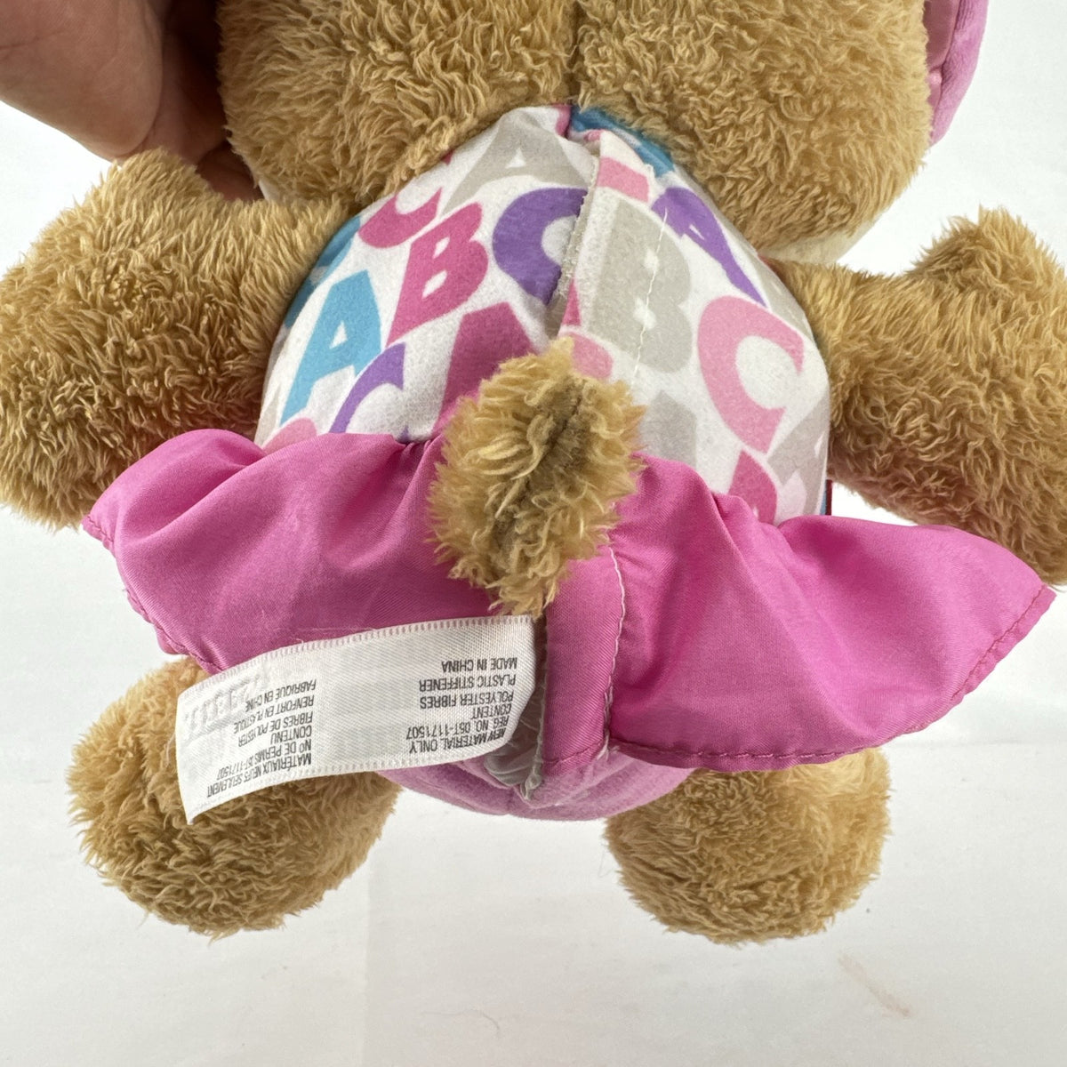 Fisher-Price Smart Stages Sis musical puppy plush toy in colorful alphabet dress