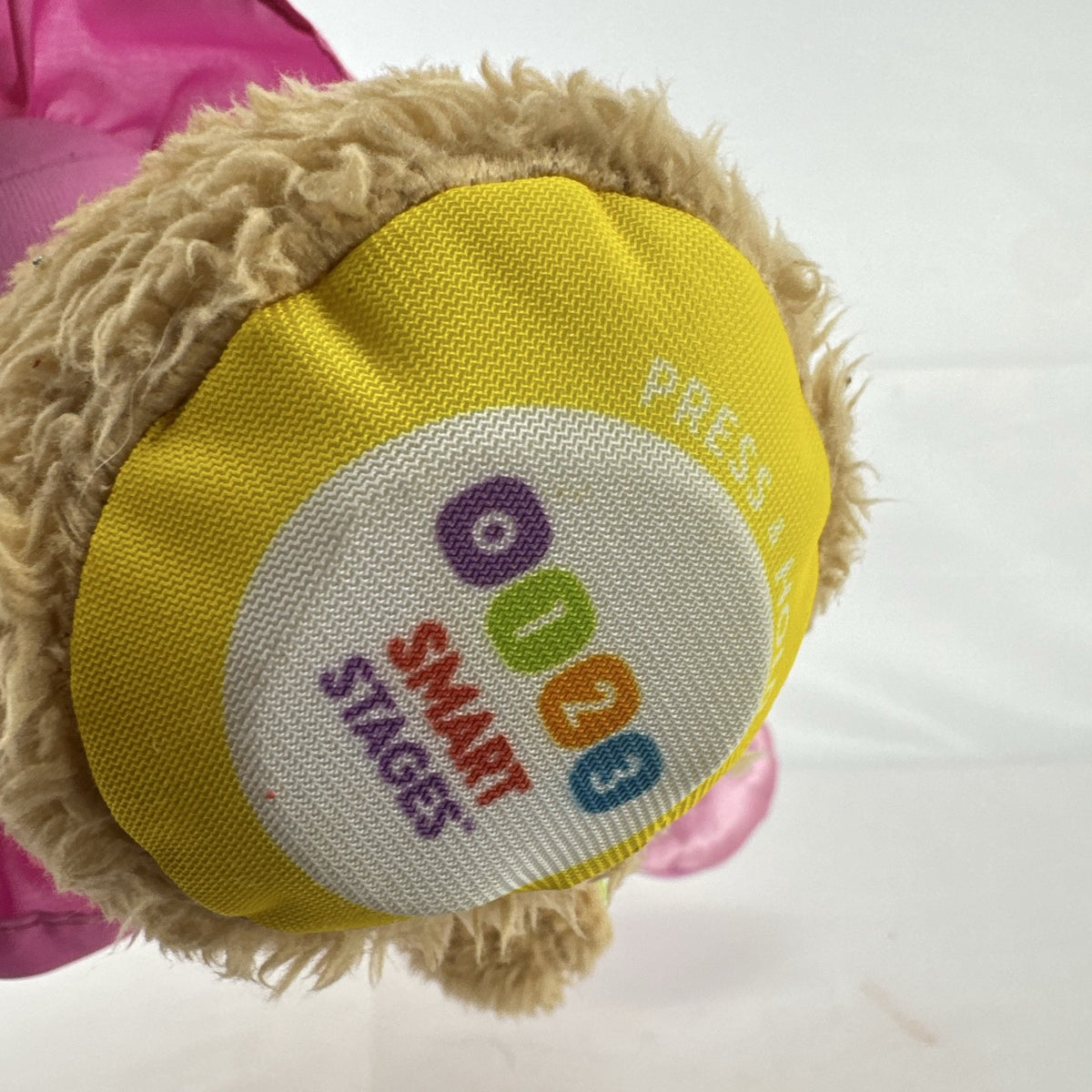 Fisher-Price Smart Stages Sis musical puppy plush toy in colorful alphabet dress