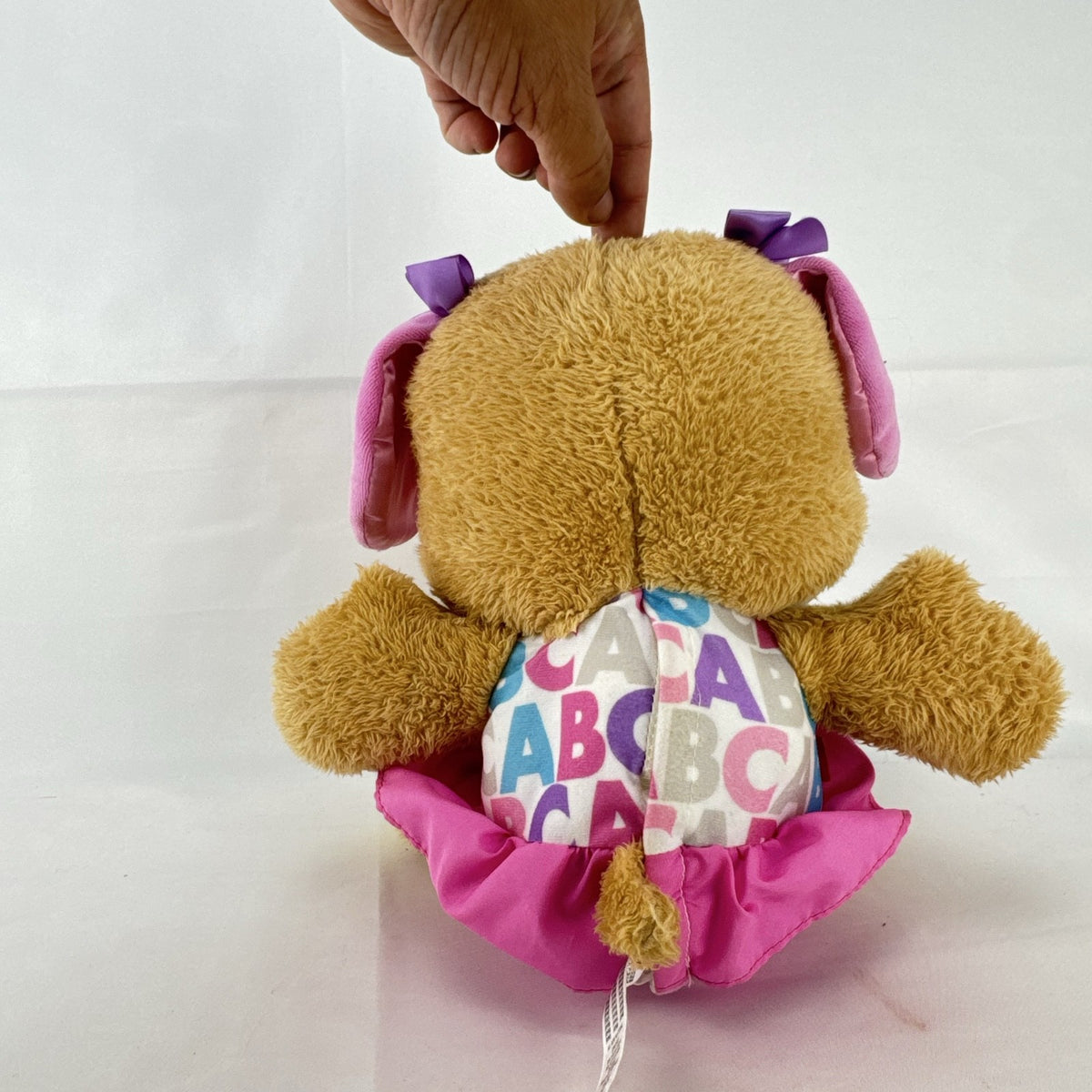 Fisher-Price Smart Stages Sis musical puppy plush toy in colorful alphabet dress