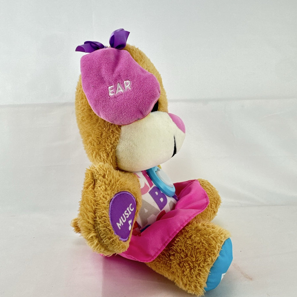 Fisher-Price Smart Stages Sis musical puppy plush toy in colorful alphabet dress