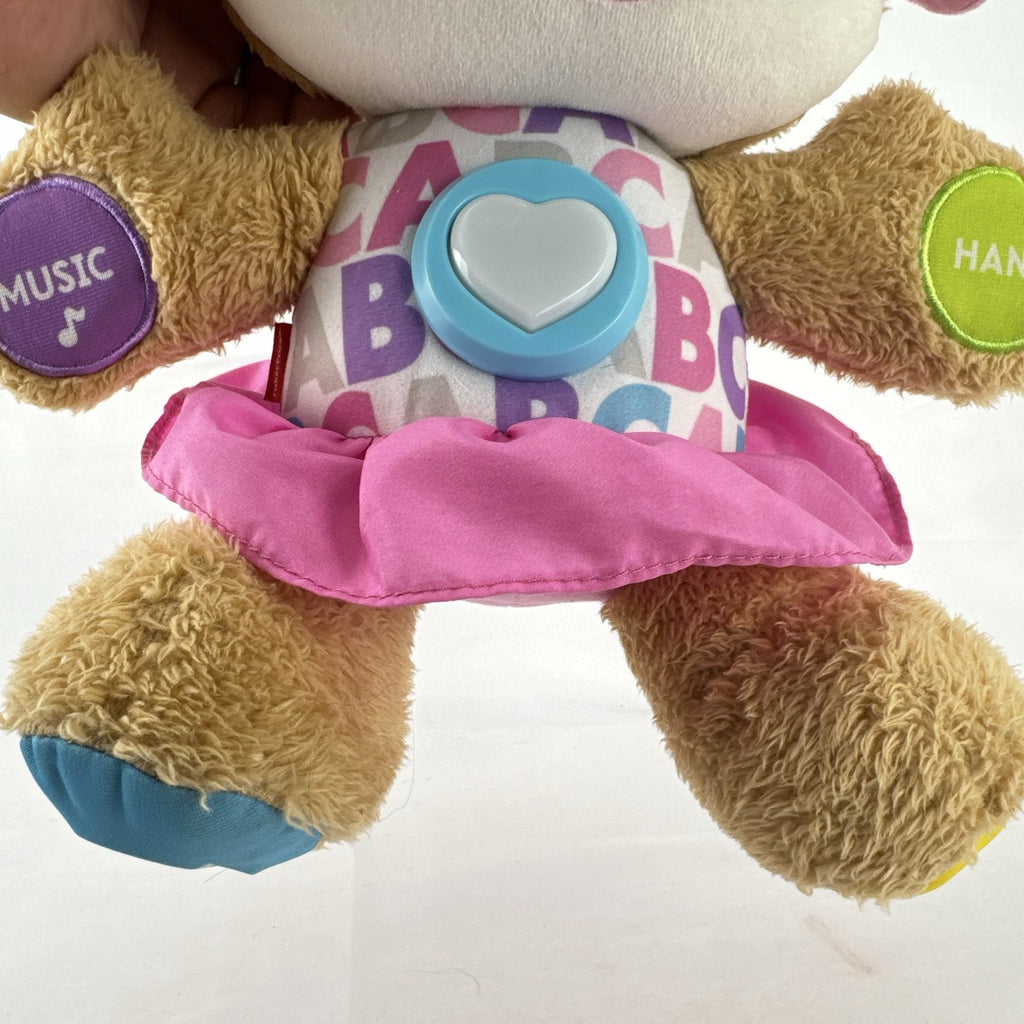 Fisher-Price Smart Stages Sis musical puppy plush toy in colorful alphabet dress