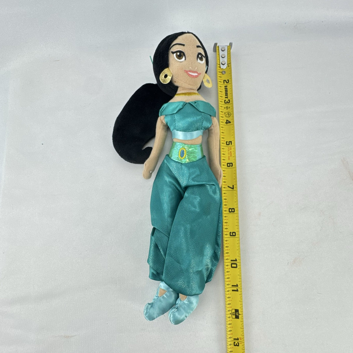 Disney Princess Jasmine 12-inch plush doll wearing teal satin outfit with gold accents