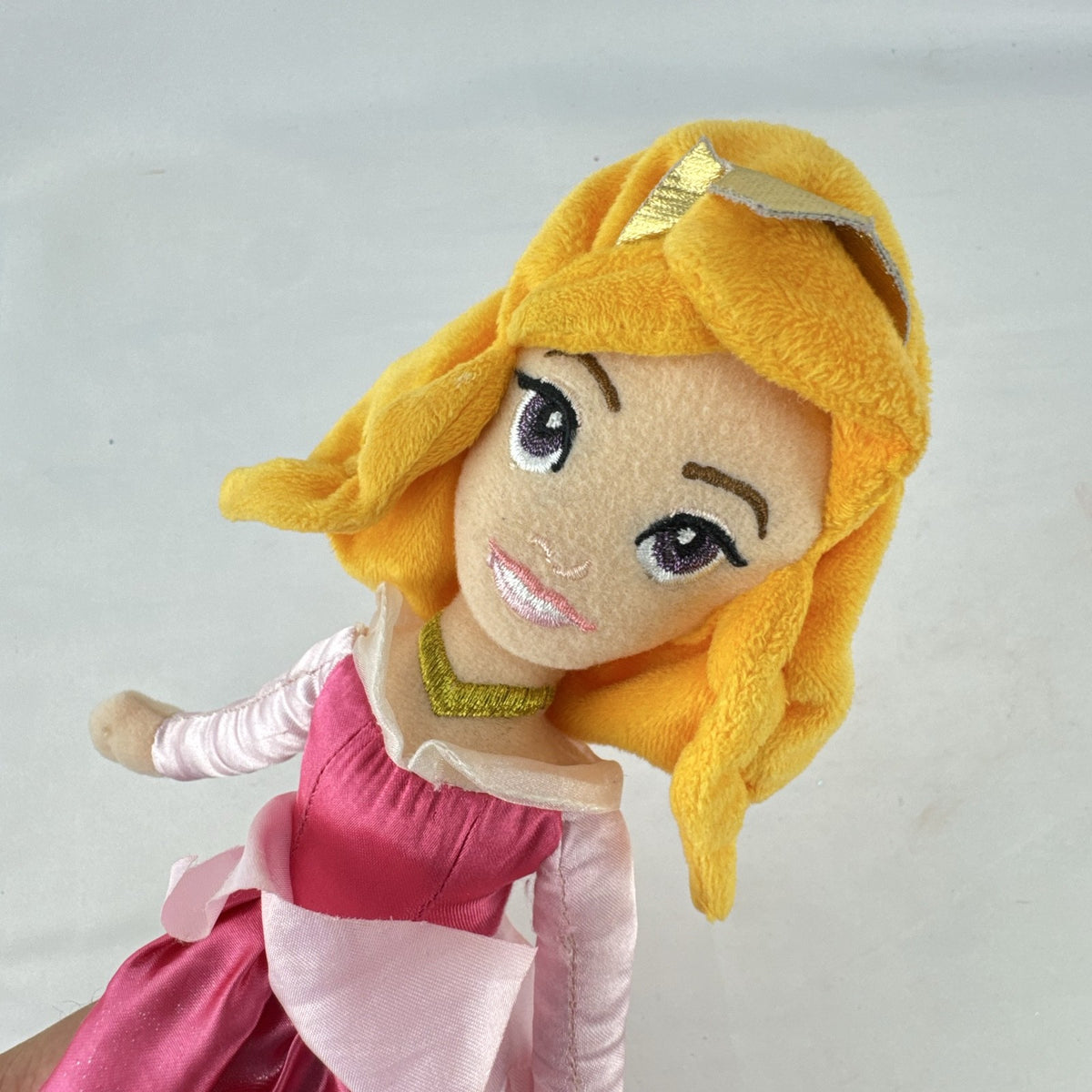 Disney Princess Aurora 10-inch plush doll wearing a pink satin ballgown and golden tiara