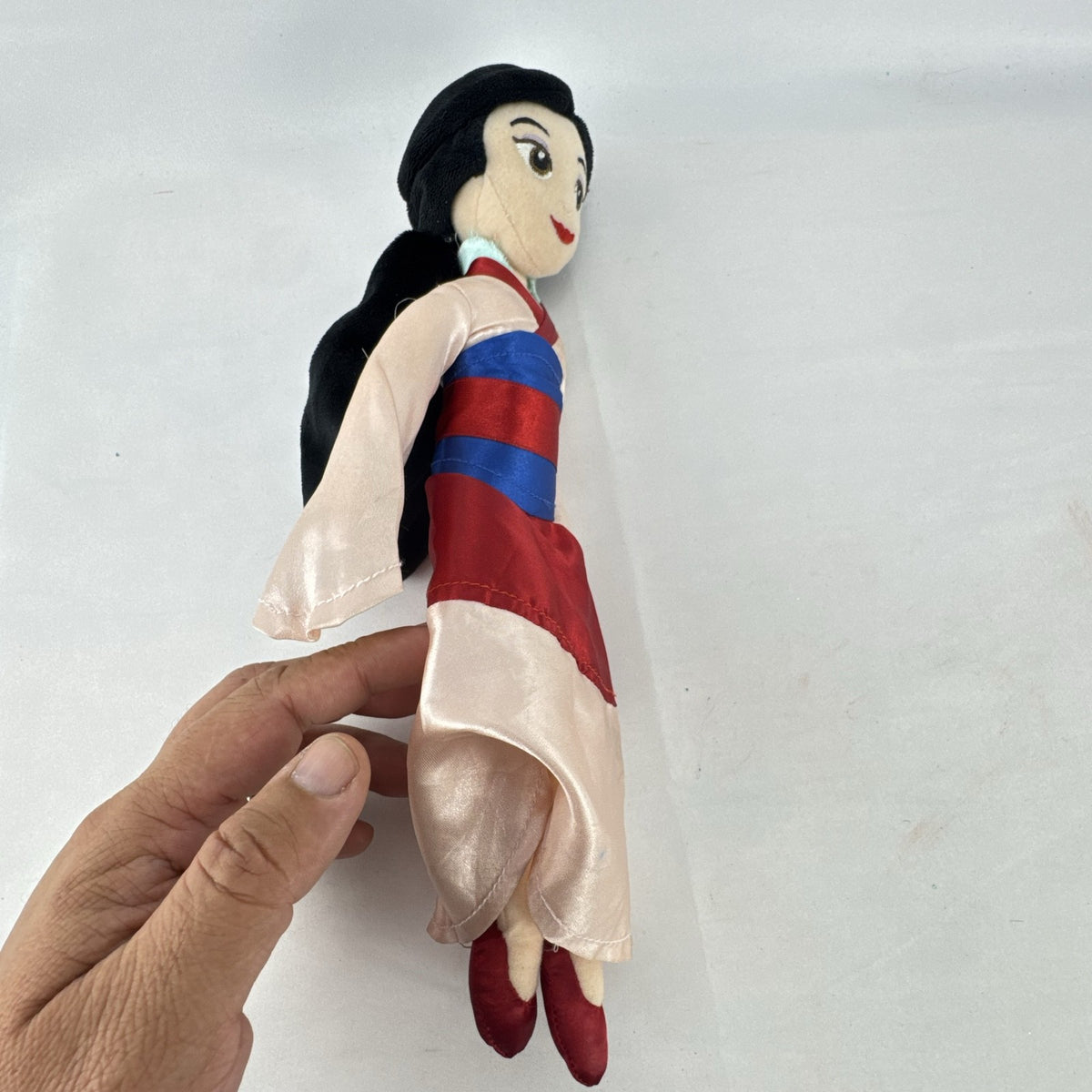 Disney Mulan 12-inch plush doll wearing traditional pink and red satin matchmaker dress