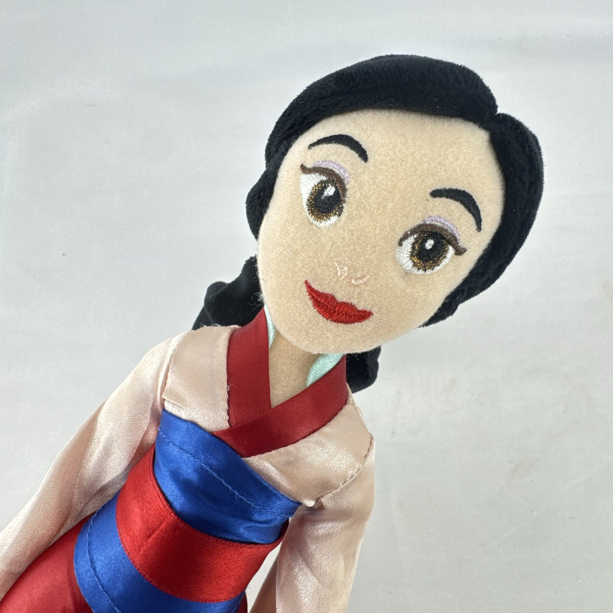 Disney Mulan 12-inch plush doll wearing traditional pink and red satin matchmaker dress