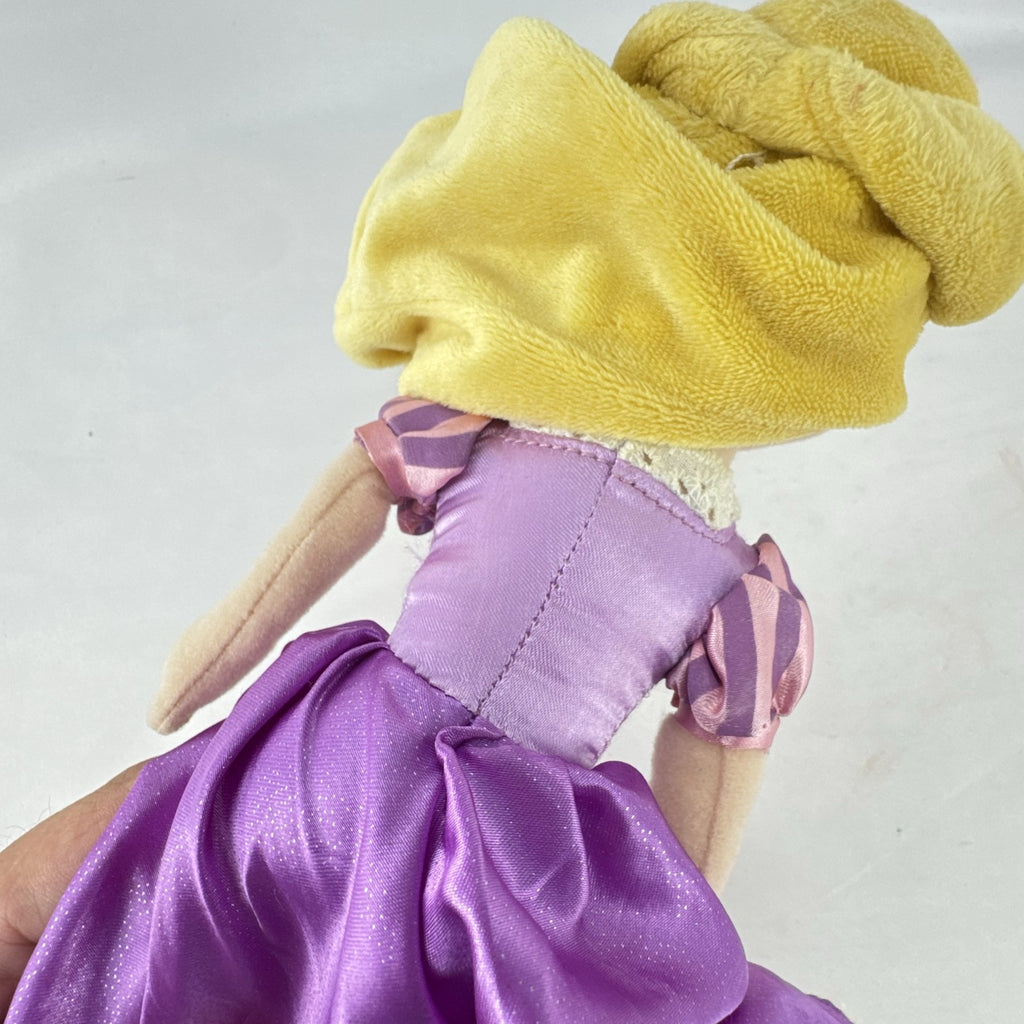Disney Tangled Rapunzel 11-inch plush doll wearing purple satin dress