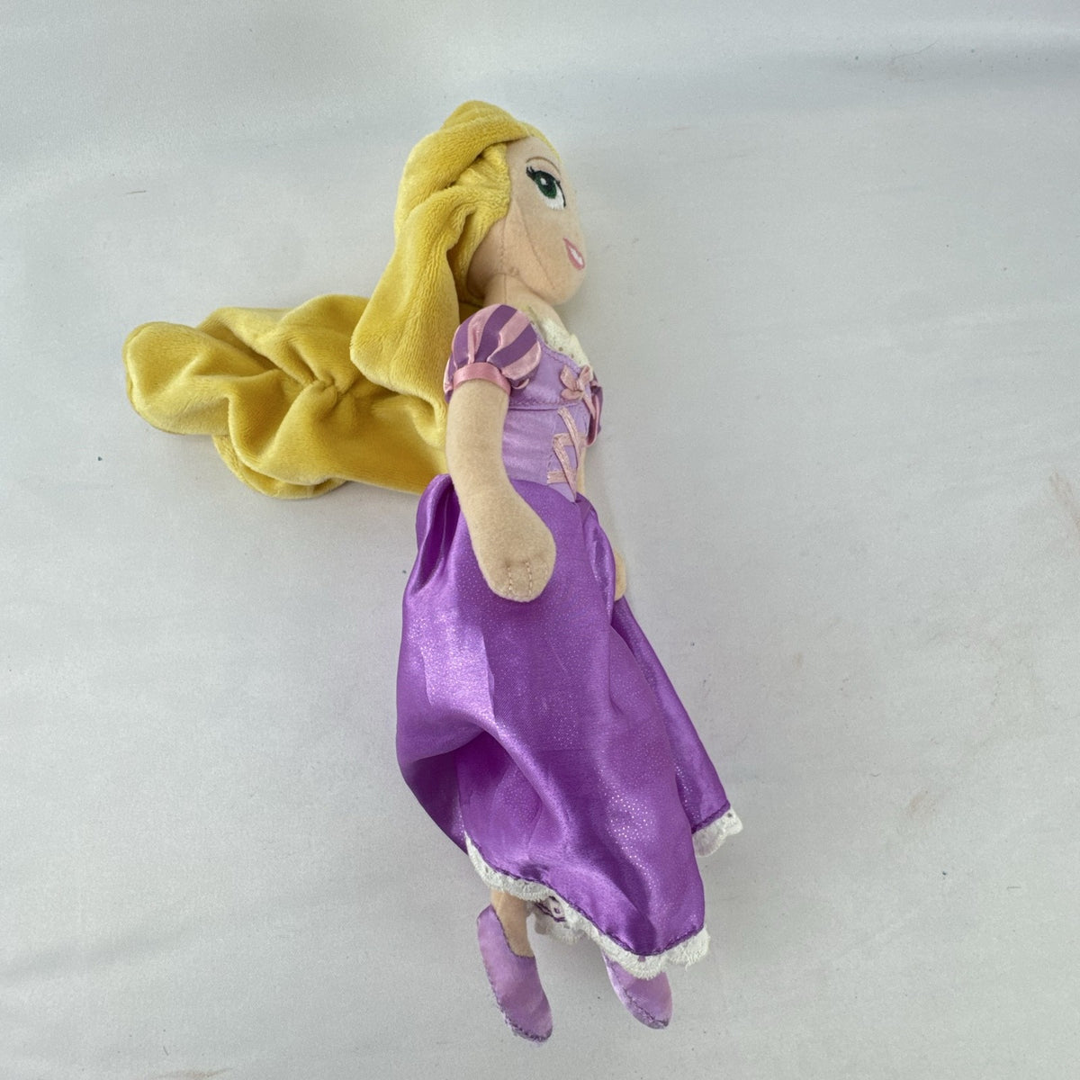 Disney Tangled Rapunzel 11-inch plush doll wearing purple satin dress
