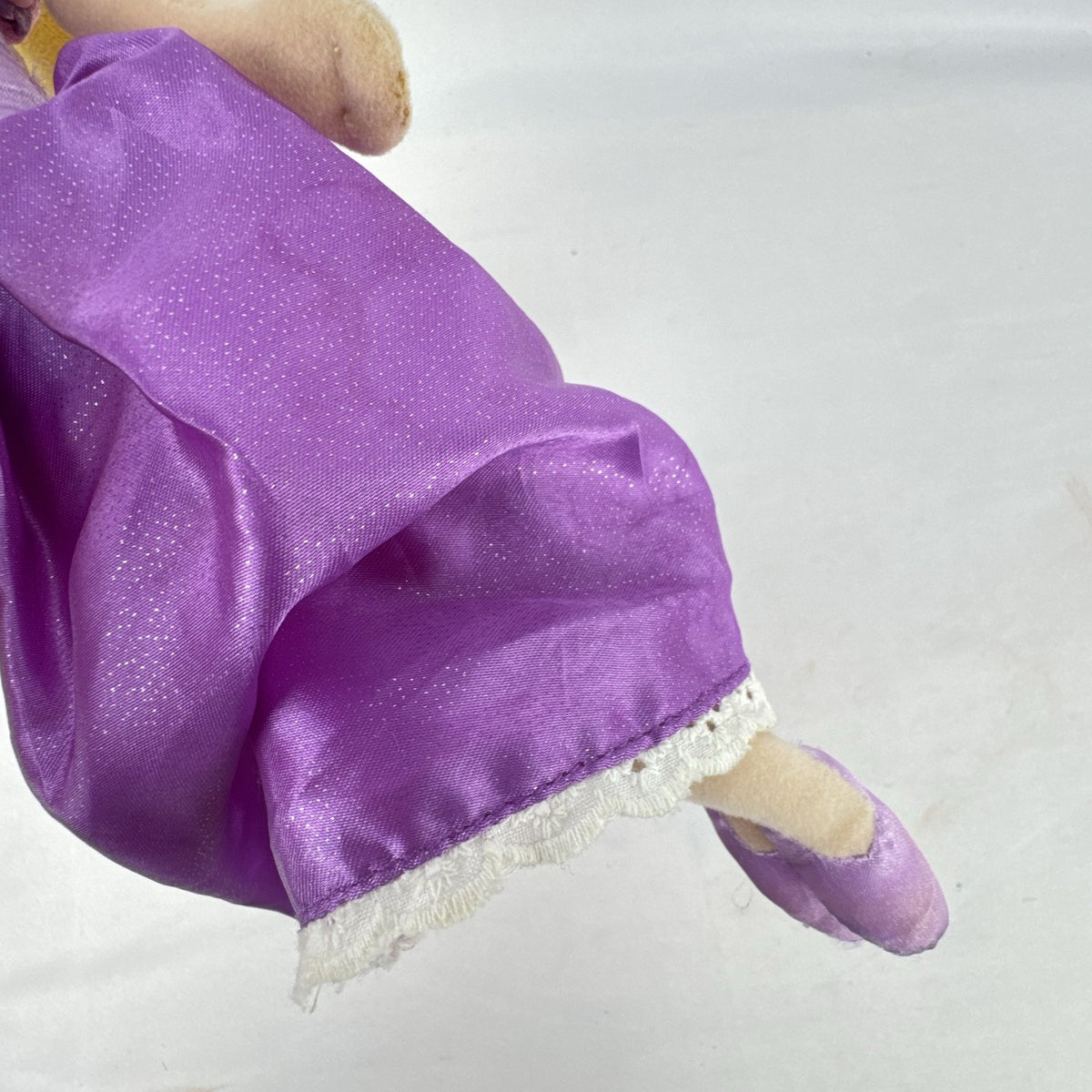 Disney Tangled Rapunzel 11-inch plush doll wearing purple satin dress