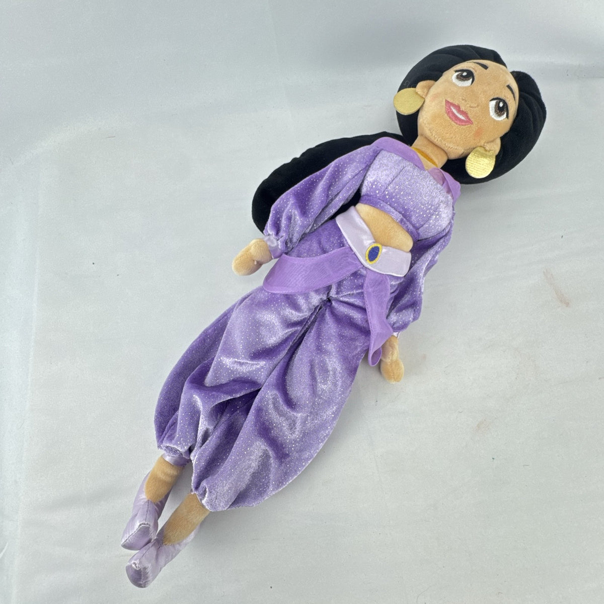 Disney Princess Jasmine 18-inch soft plush doll wearing a sparkling purple outfit and gold fabric accessories.