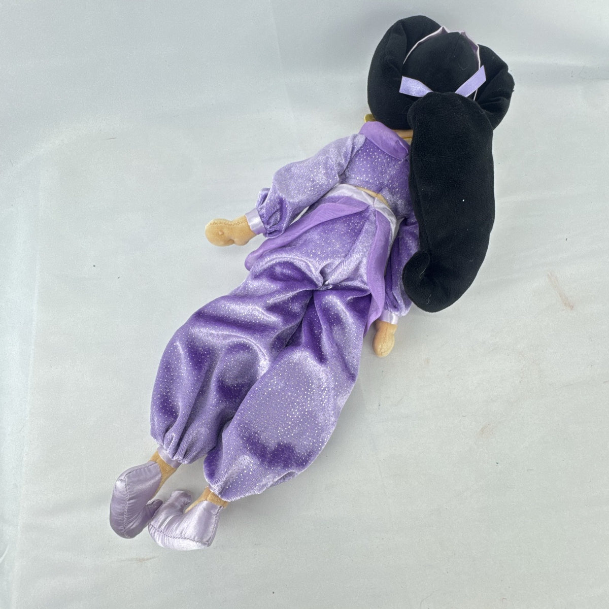 Disney Princess Jasmine 18-inch soft plush doll wearing a sparkling purple outfit and gold fabric accessories.