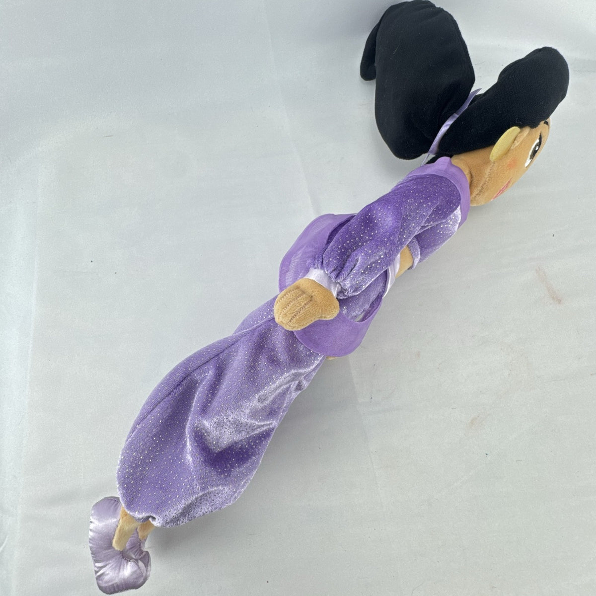 Disney Princess Jasmine 18-inch soft plush doll wearing a sparkling purple outfit and gold fabric accessories.