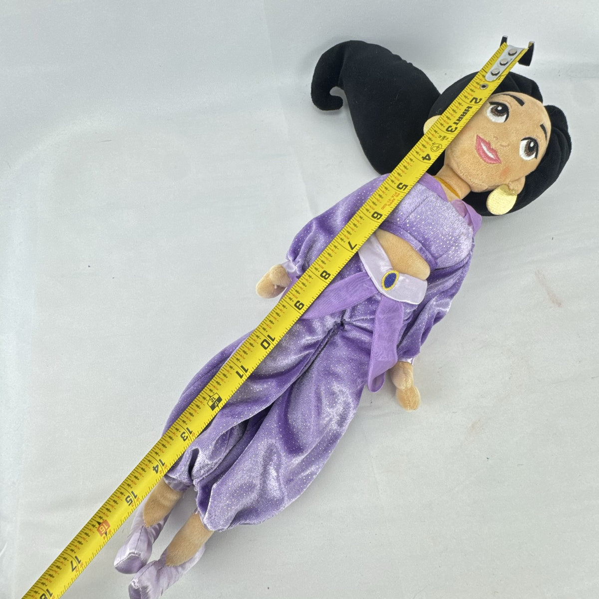 Disney Princess Jasmine 18-inch soft plush doll wearing a sparkling purple outfit and gold fabric accessories.