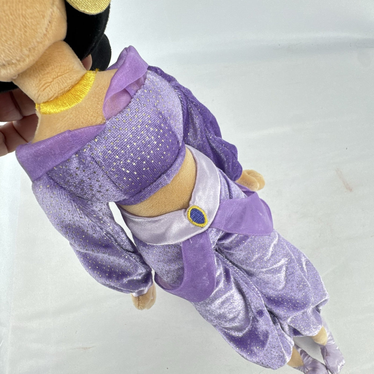 Disney Princess Jasmine 18-inch soft plush doll wearing a sparkling purple outfit and gold fabric accessories.