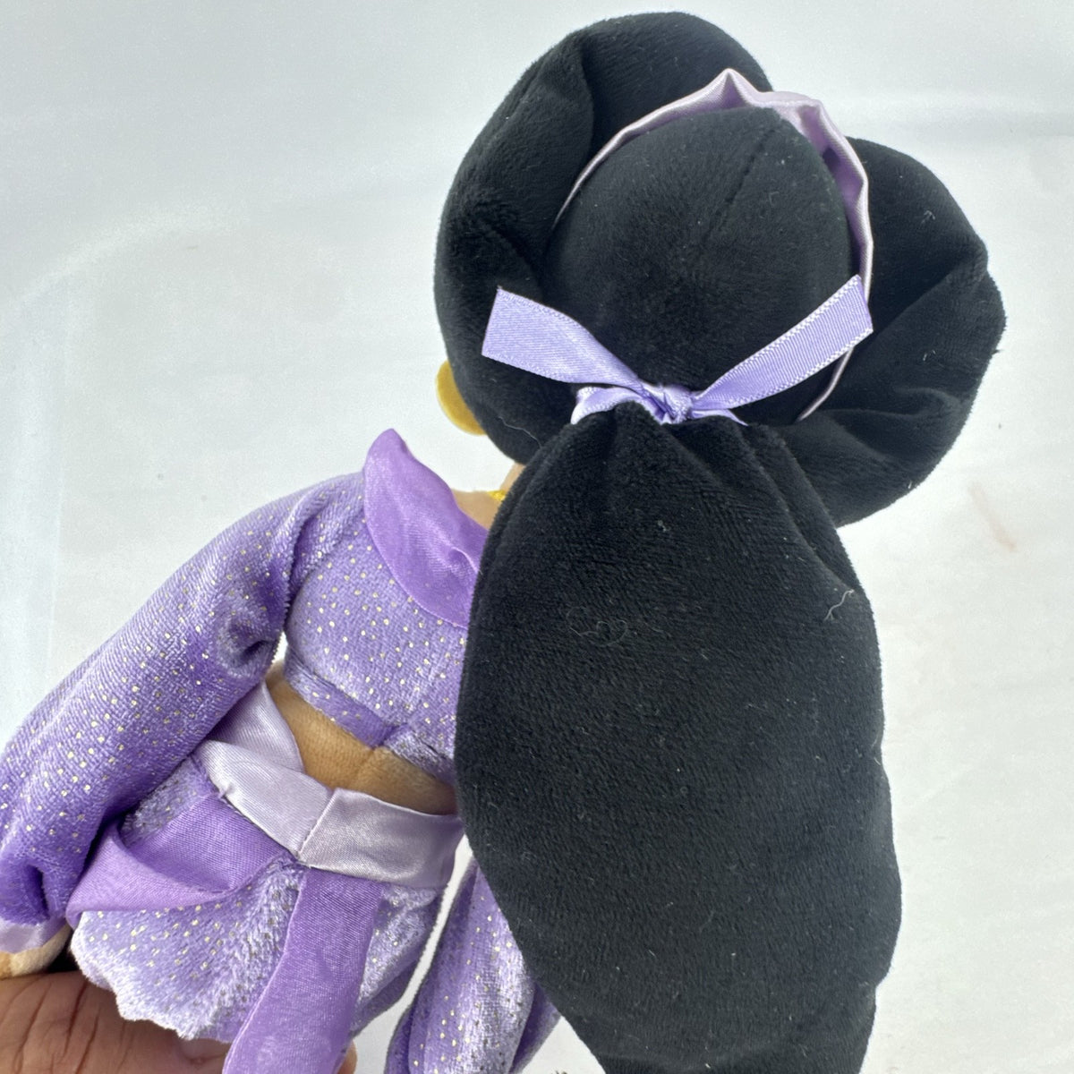 Disney Princess Jasmine 18-inch soft plush doll wearing a sparkling purple outfit and gold fabric accessories.