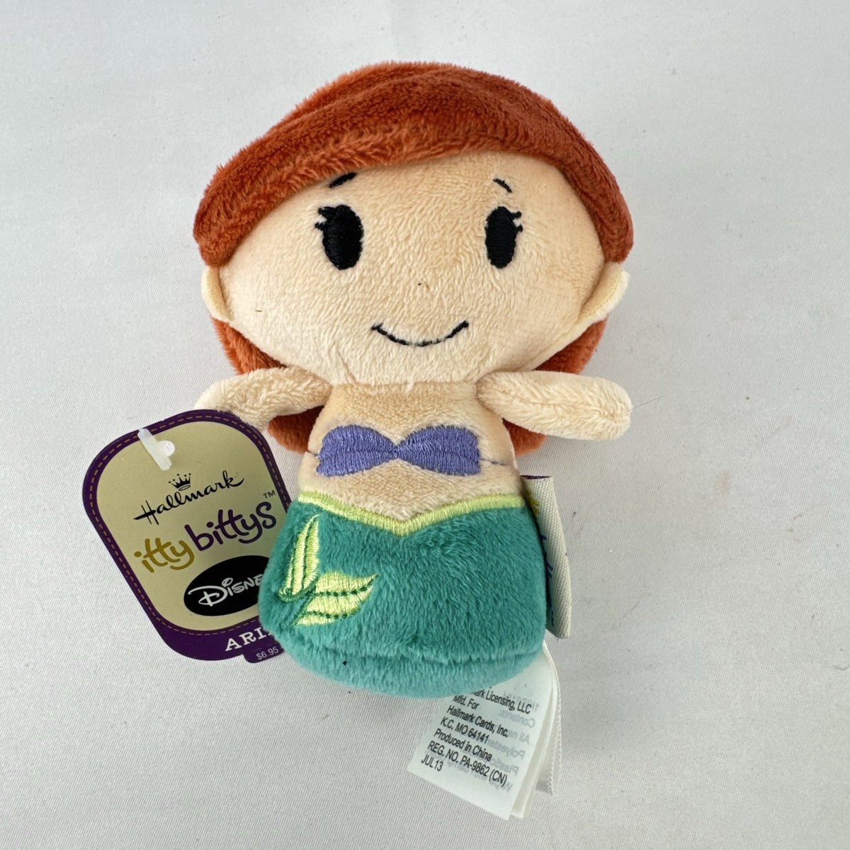 Hallmark itty bittys Ariel mini plush doll with original tags showing green tail and purple top.