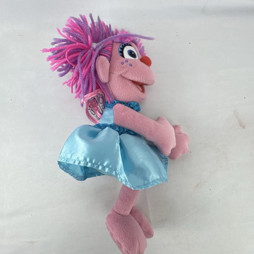 Sesame Street 11-inch Abby Cadabby fairy plush doll wearing blue ruffled dress with wings