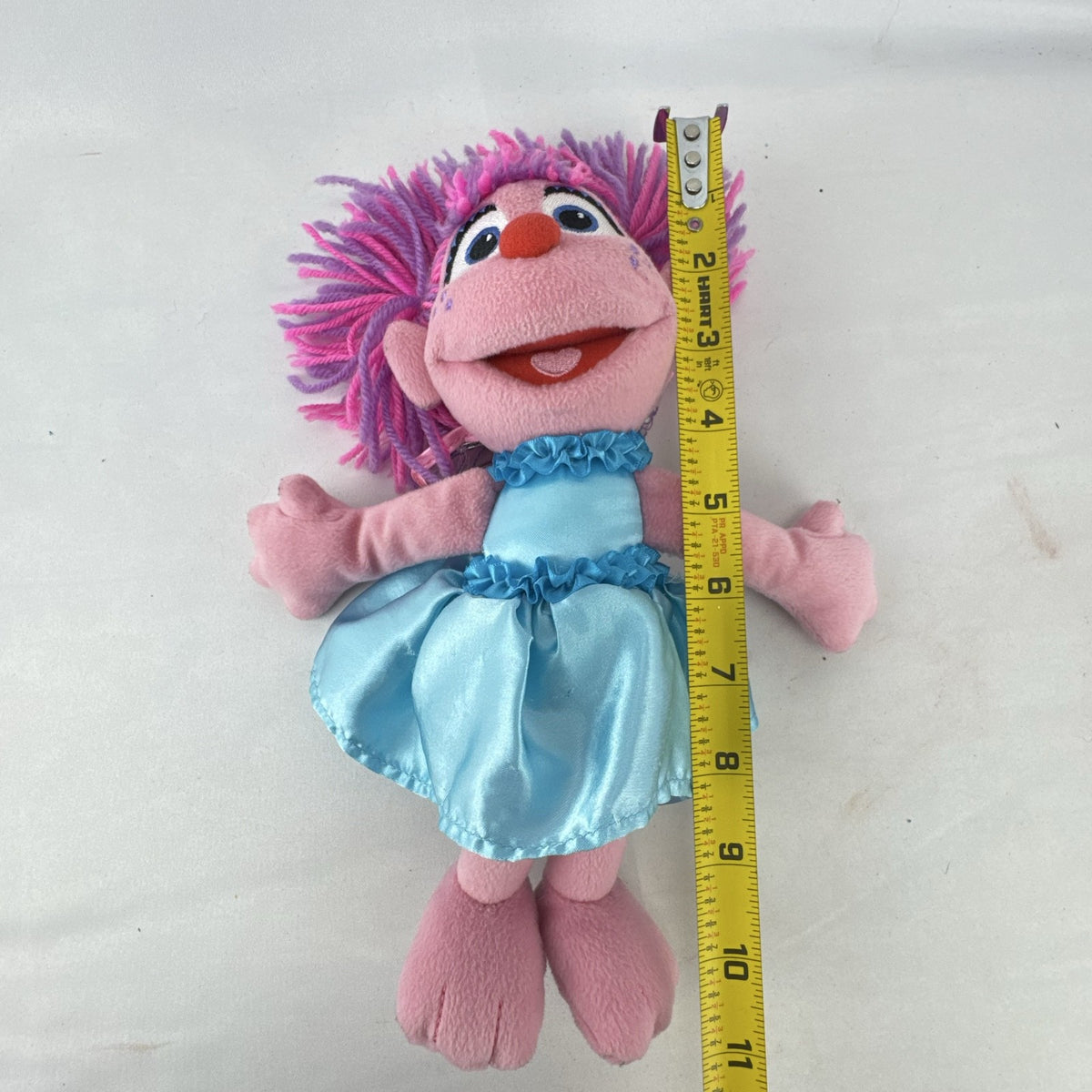 Sesame Street 11-inch Abby Cadabby fairy plush doll wearing blue ruffled dress with wings