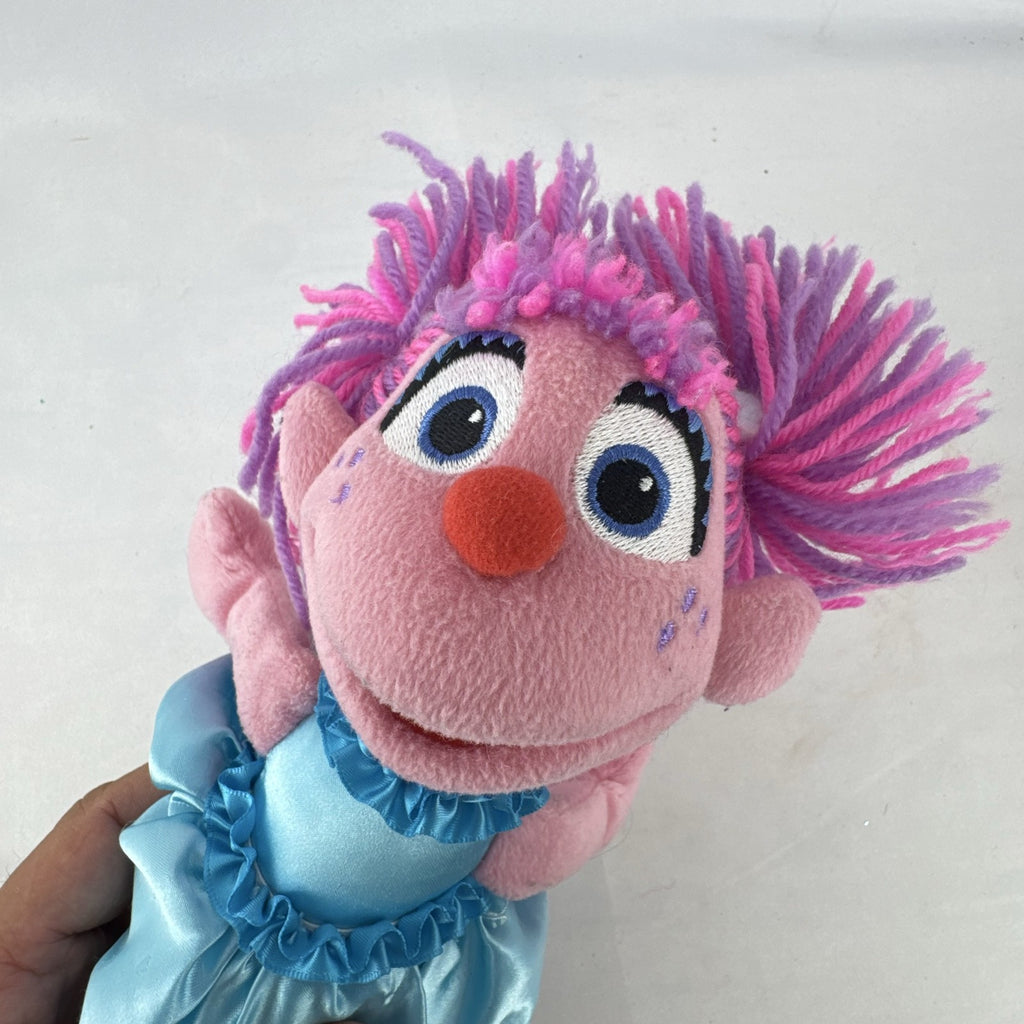 Sesame Street 11-inch Abby Cadabby fairy plush doll wearing blue ruffled dress with wings