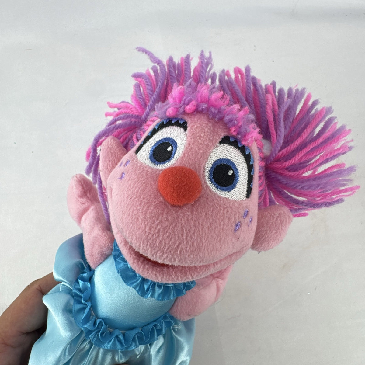 Sesame Street 11-inch Abby Cadabby fairy plush doll wearing blue ruffled dress with wings