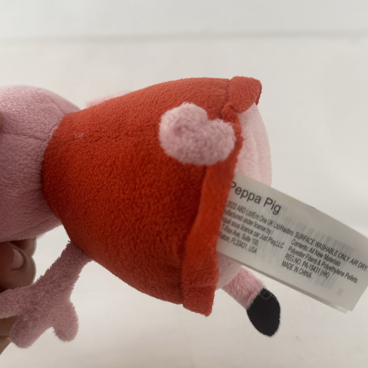 Just Play 7-inch Peppa Pig pink plush bean bag doll wearing a red dress