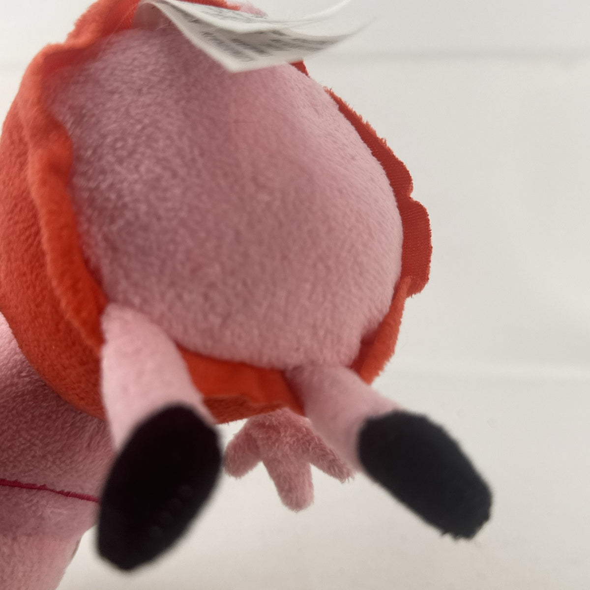 Just Play 7-inch Peppa Pig pink plush bean bag doll wearing a red dress