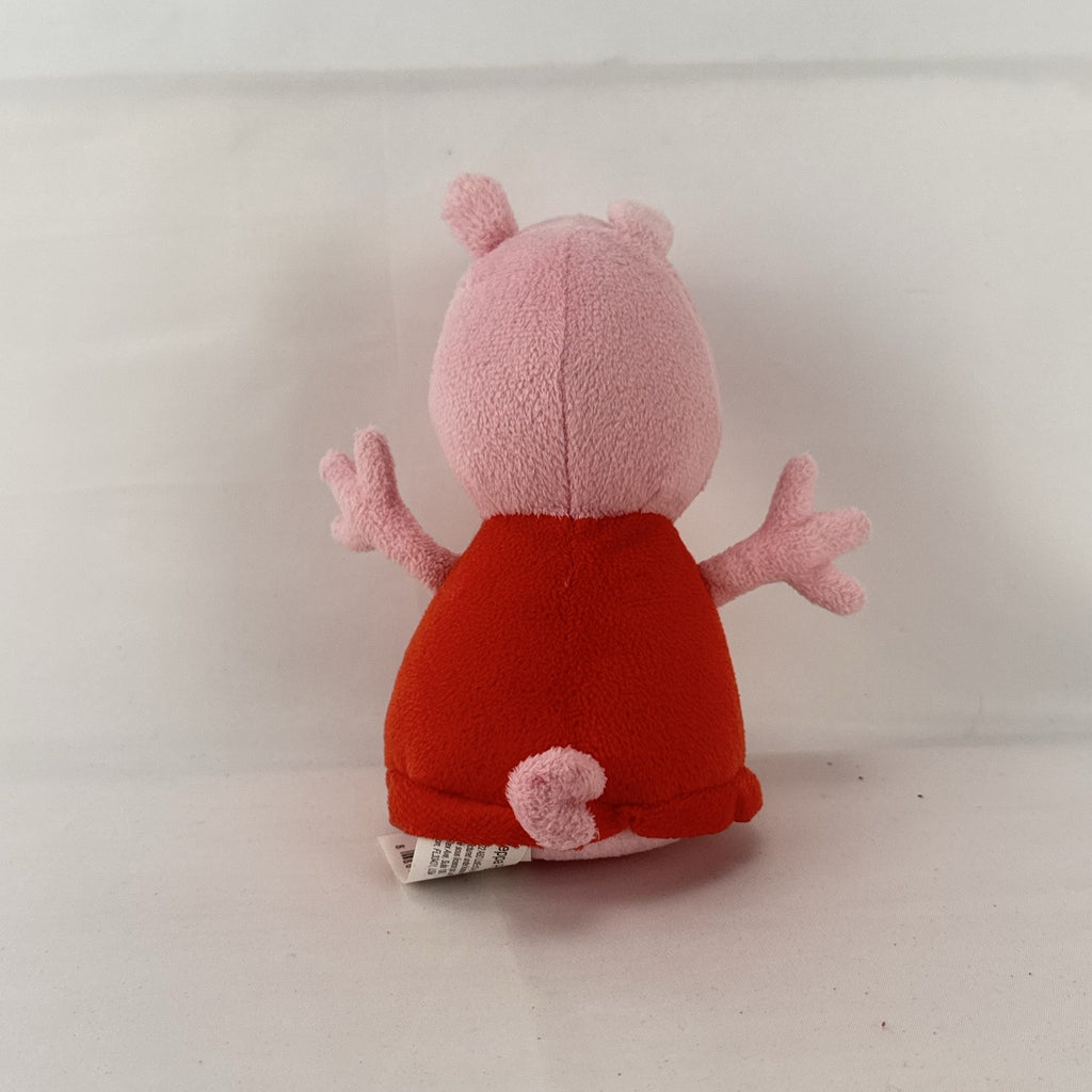 Just Play 7-inch Peppa Pig pink plush bean bag doll wearing a red dress