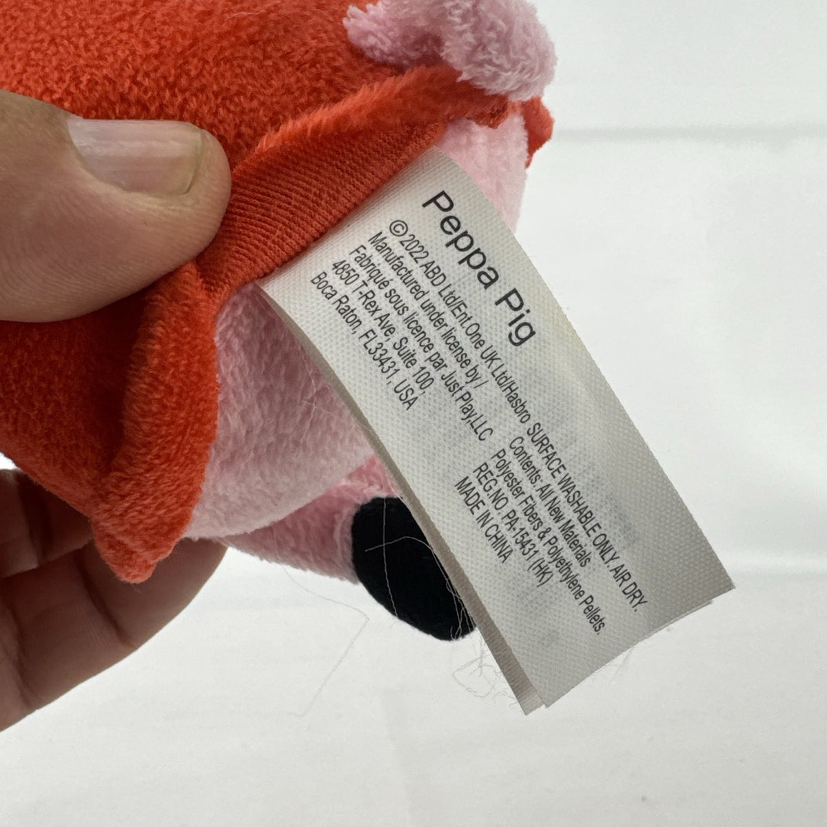 Just Play 7-inch Peppa Pig pink plush bean bag doll wearing a red dress