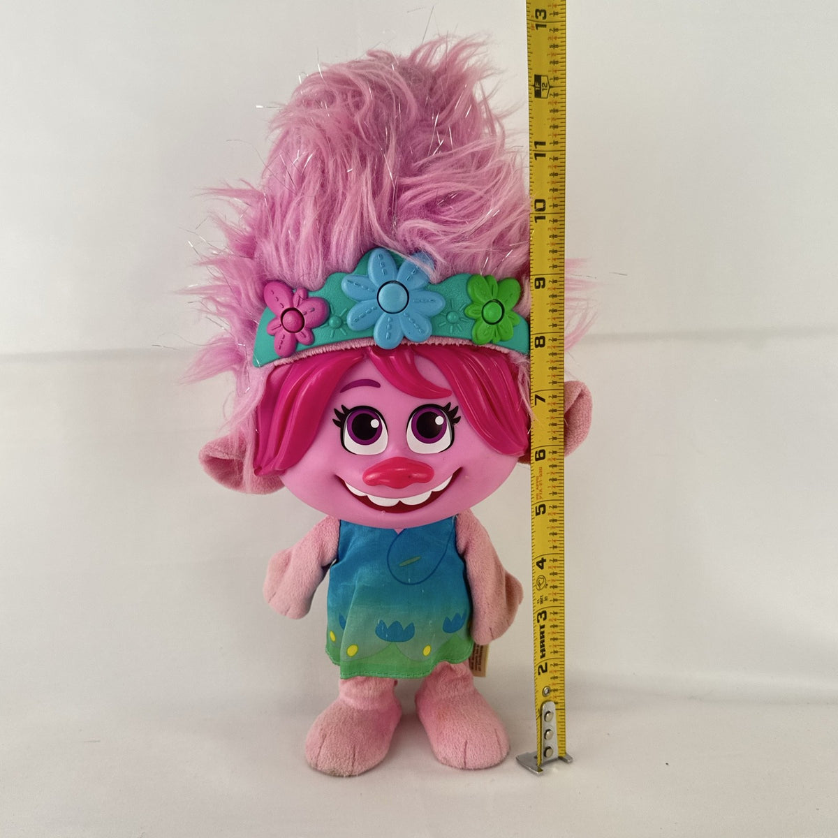Just Play DreamWorks Trolls Princess Poppy 12-inch plush doll with molded plastic face and pink tinsel hair
