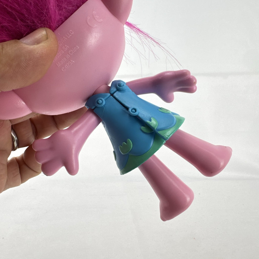 Hasbro DreamWorks Trolls Poppy doll with tall pink hair wearing blue patterned dress