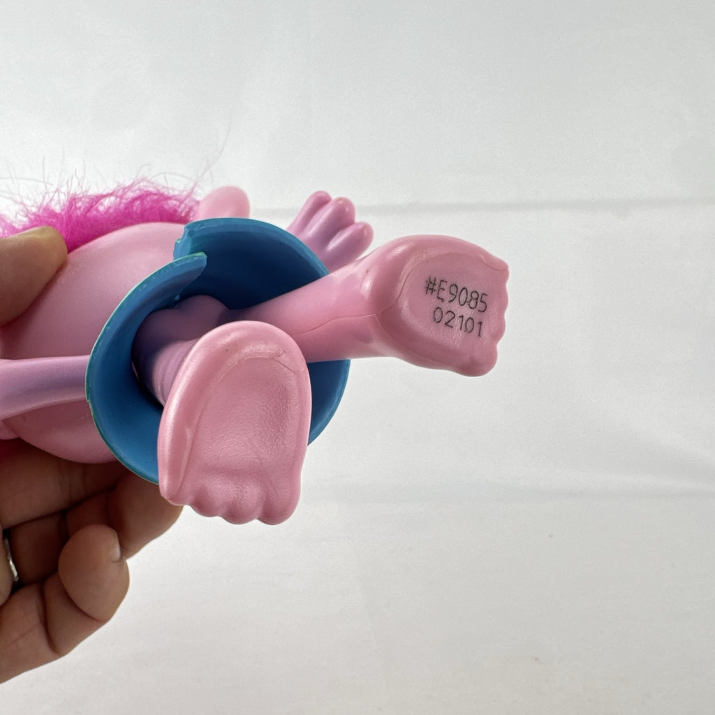 Hasbro DreamWorks Trolls Poppy doll with tall pink hair wearing blue patterned dress