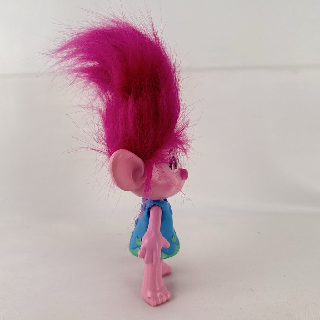 Hasbro DreamWorks Trolls Poppy doll with tall pink hair wearing blue patterned dress