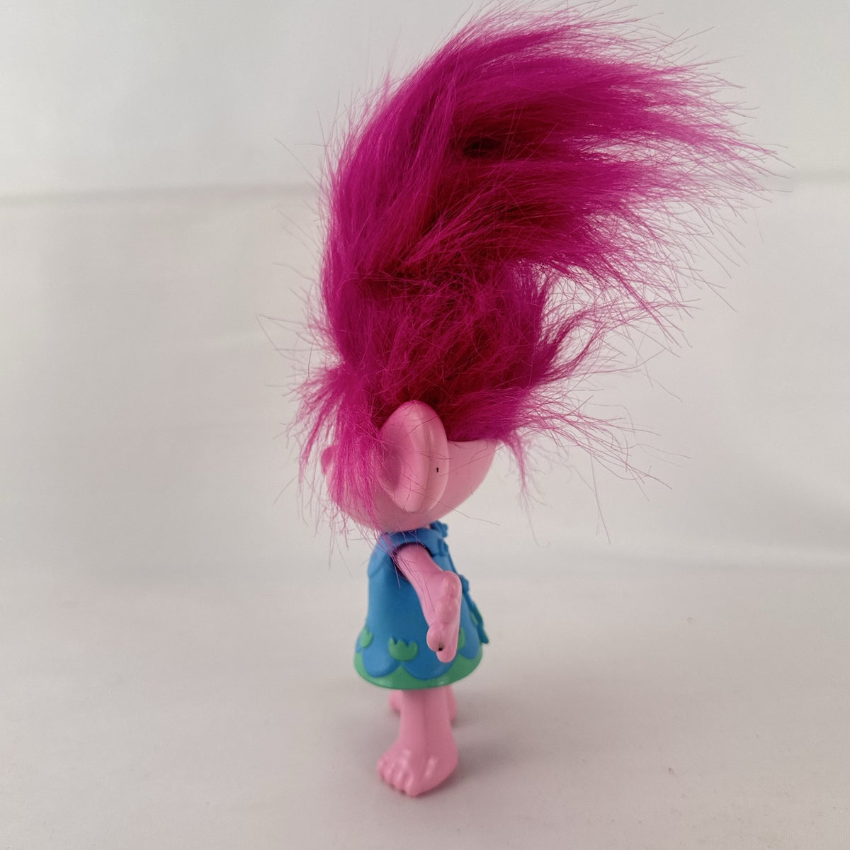 Hasbro DreamWorks Trolls Poppy doll with tall pink hair wearing blue patterned dress