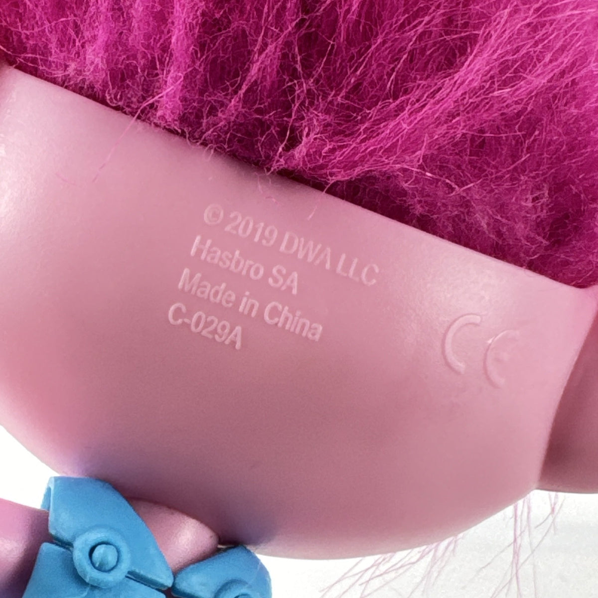 Hasbro DreamWorks Trolls Poppy doll with tall pink hair wearing blue patterned dress