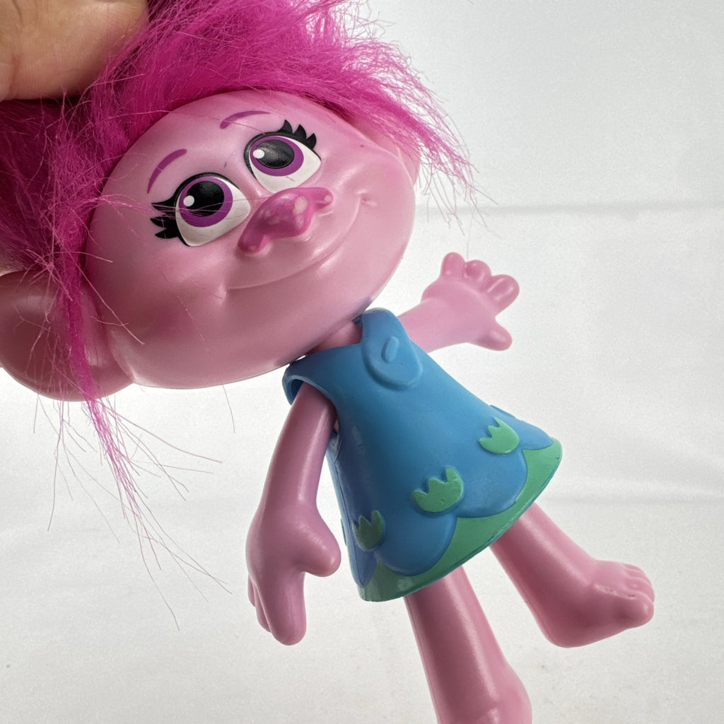 Hasbro DreamWorks Trolls Poppy doll with tall pink hair wearing blue patterned dress