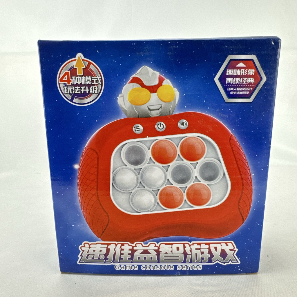 Red Ultraman quick push handheld electronic game console with light-up buttons in original packaging