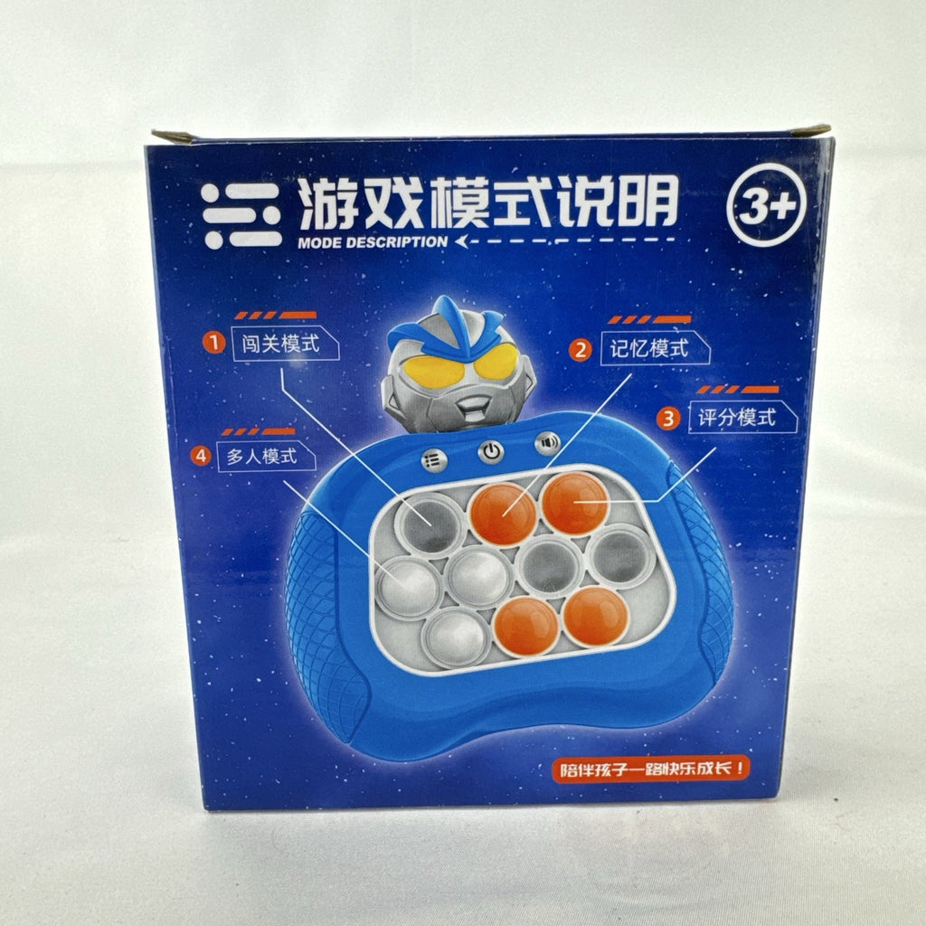 Red Ultraman quick push handheld electronic game console with light-up buttons in original packaging