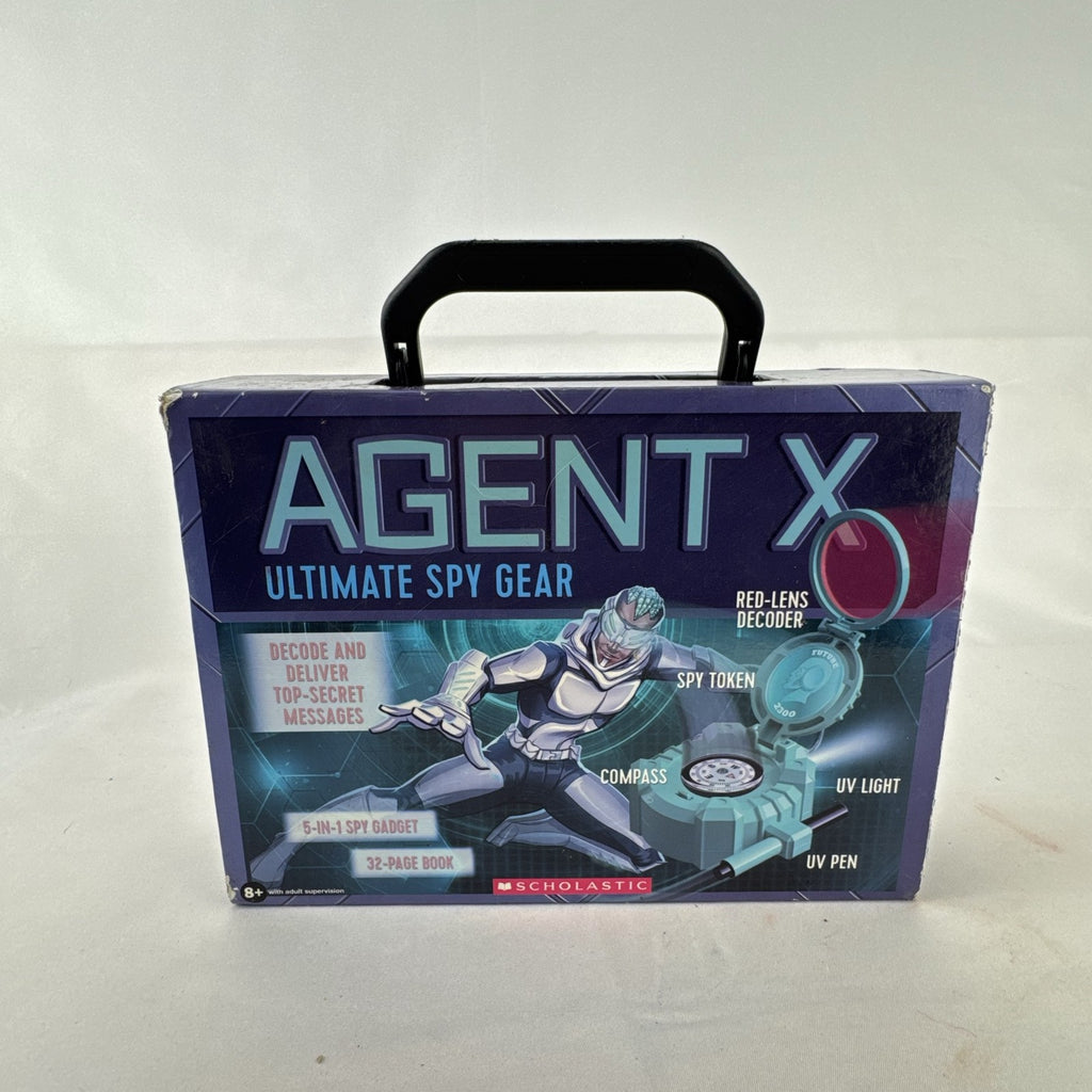 Scholastic Agent X 5-in-1 spy gear gadget kit inside its green illustrated carry case.