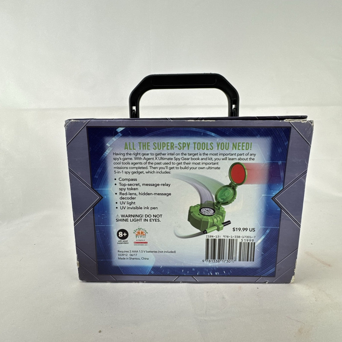 Scholastic Agent X 5-in-1 spy gear gadget kit inside its green illustrated carry case.