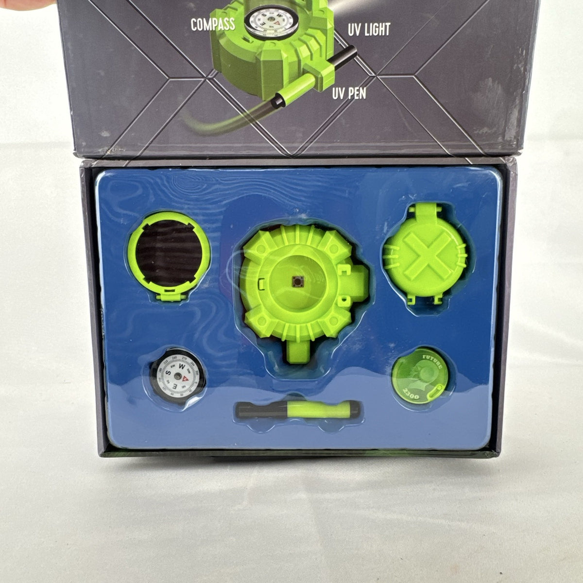 Scholastic Agent X 5-in-1 spy gear gadget kit inside its green illustrated carry case.