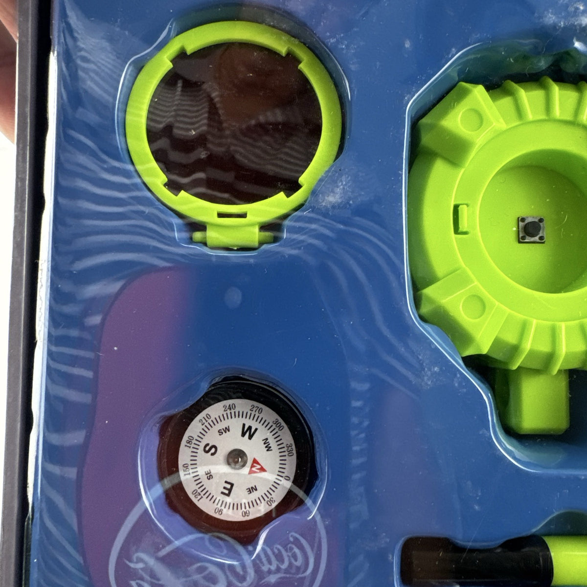 Scholastic Agent X 5-in-1 spy gear gadget kit inside its green illustrated carry case.
